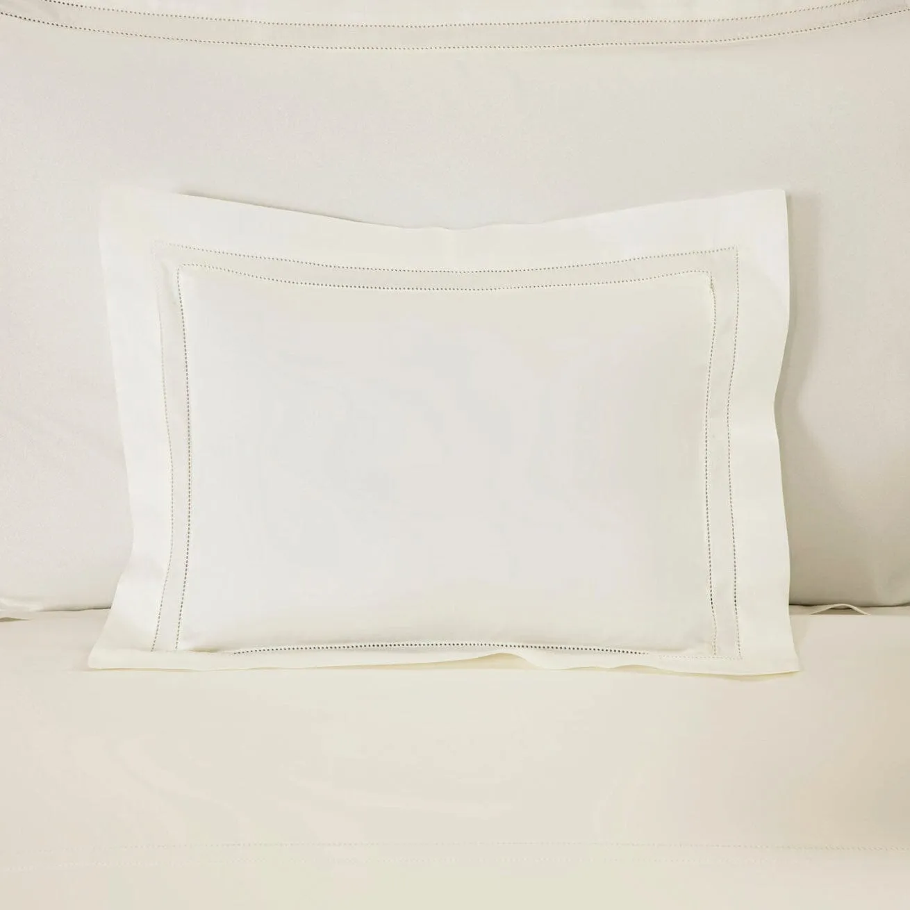 Doppio Ajour Milk Bedding by Frette