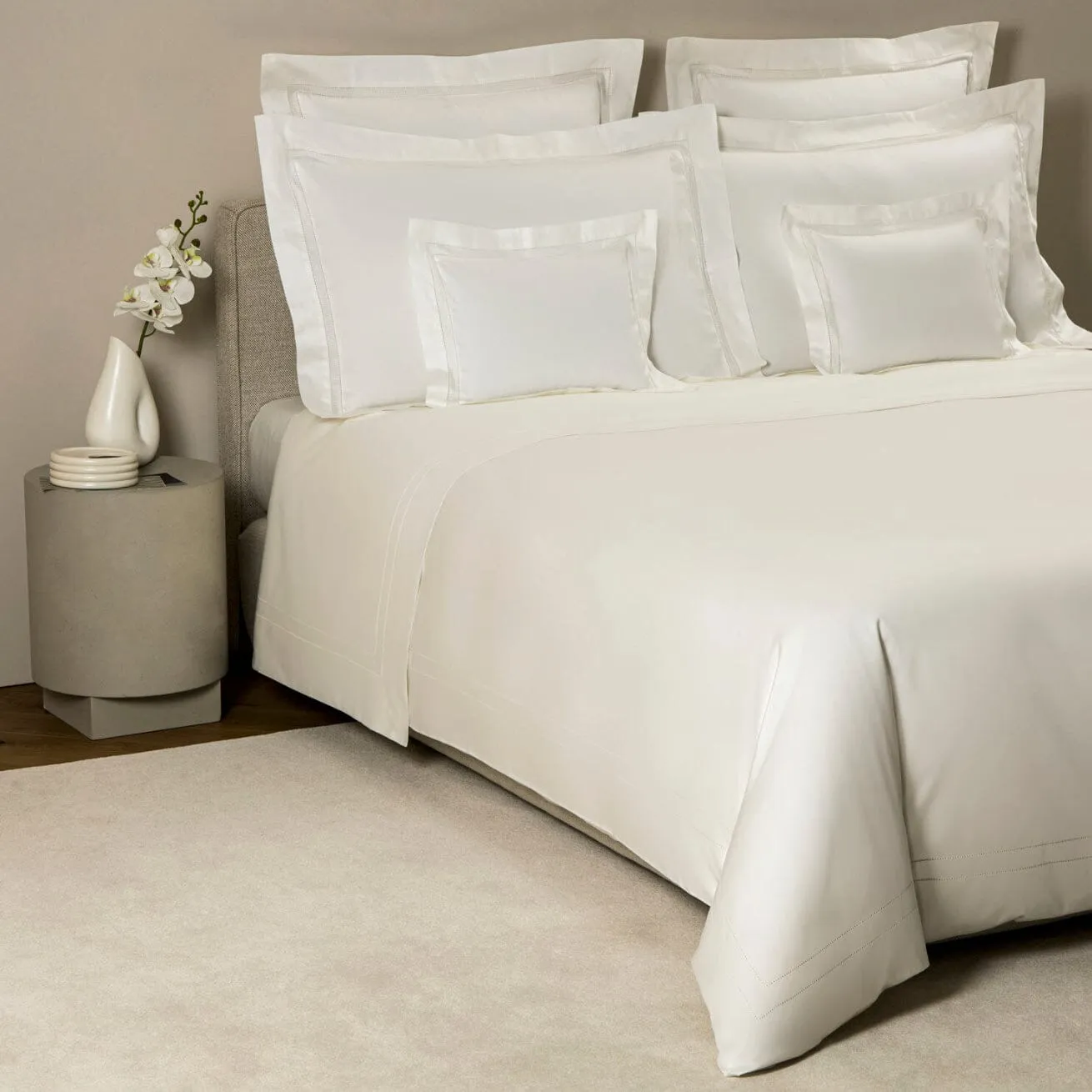Doppio Ajour Milk Bedding by Frette