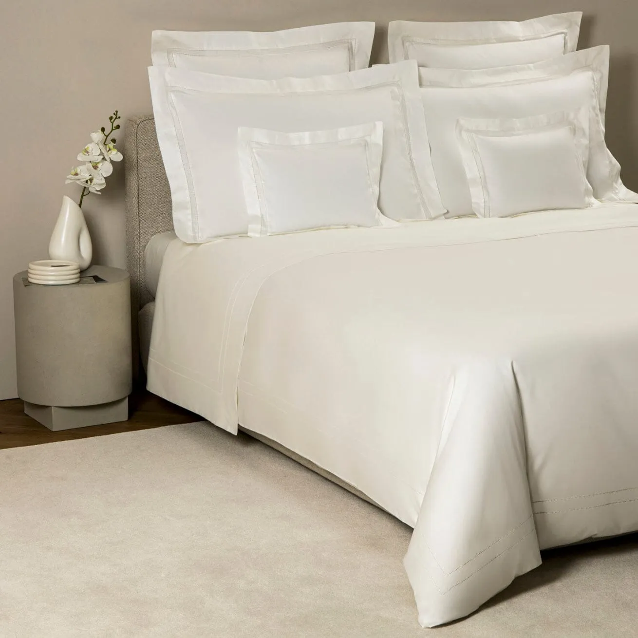 Doppio Ajour Milk Bedding by Frette