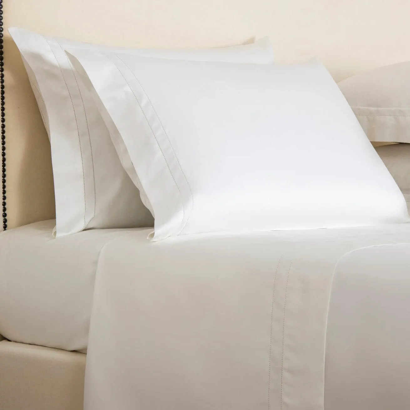 Doppio Ajour Milk Bedding by Frette
